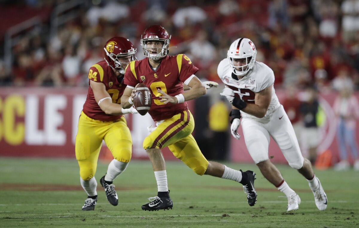 USC quarterback Kedon Slovis carries the ball against Stanford during Saturday's win.