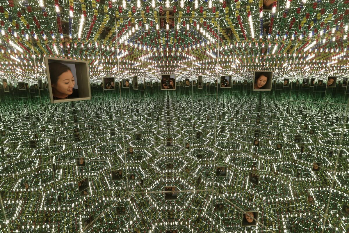Looking into "Infinity Mirrored Room — Love Forever" (1994) at the Broad museum.