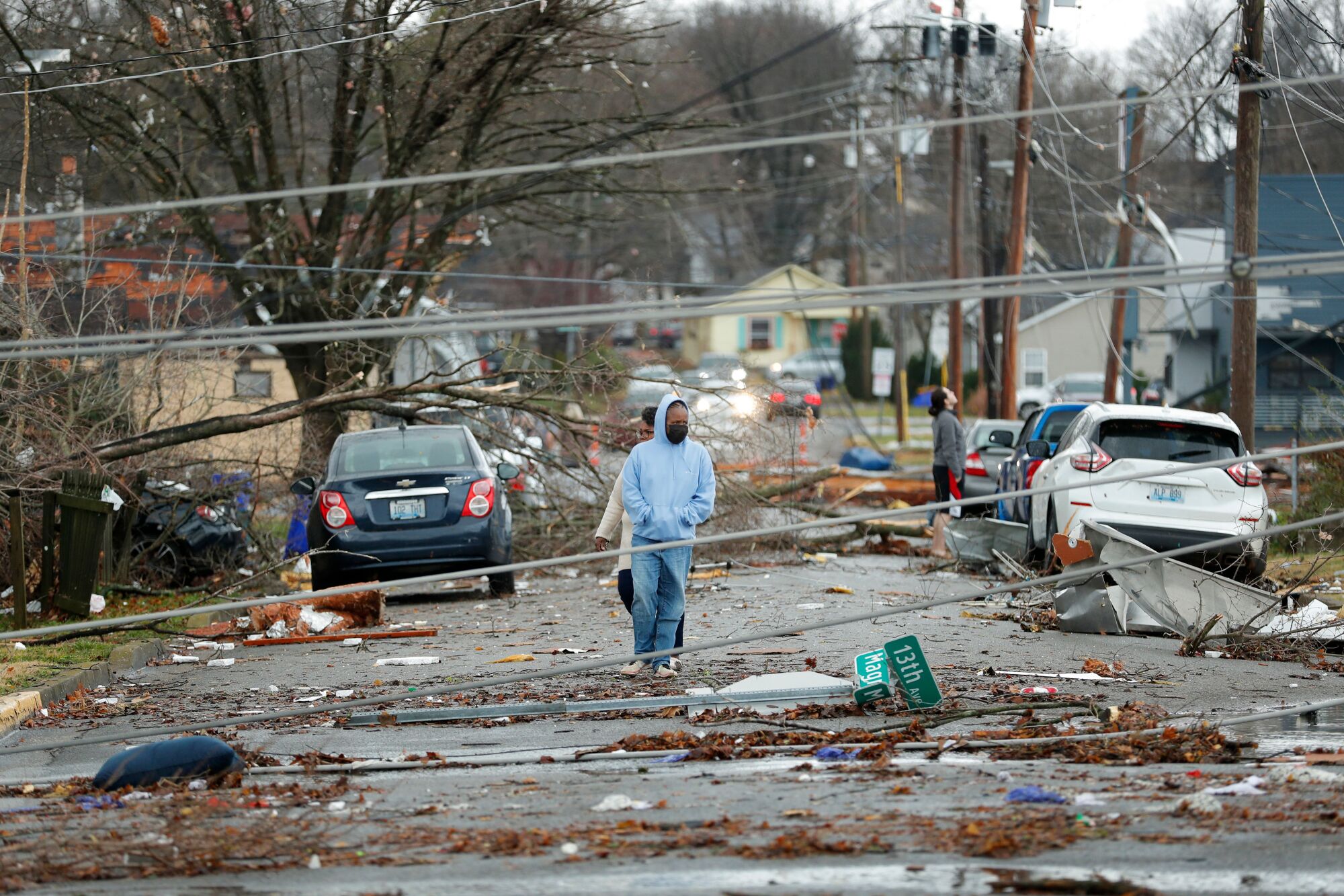Bowling Green, Ky., residents look at tornado damage.