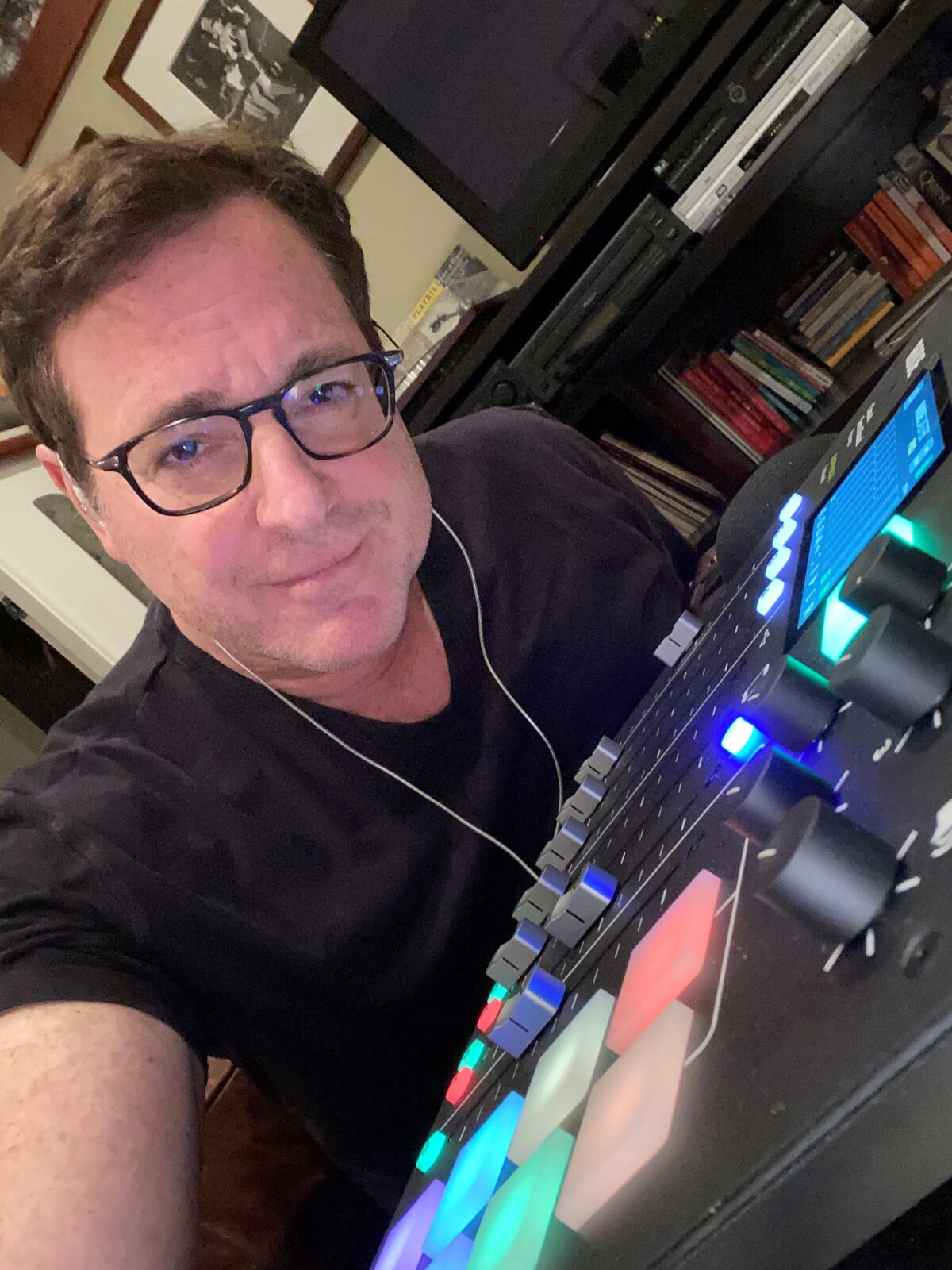 Bob Saget records his new podcast, "Bob Saget's Here for You," from home.