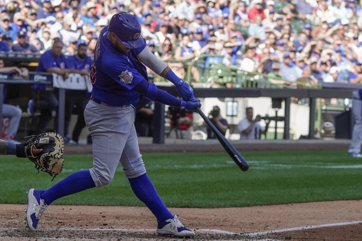 Chicago Cubs' P.J. Higgins hits an RBI double during the ninth inning of a baseball game against the Milwaukee Brewers Wednesday, July 6, 2022, in Milwaukee. (AP Photo/Morry Gash)