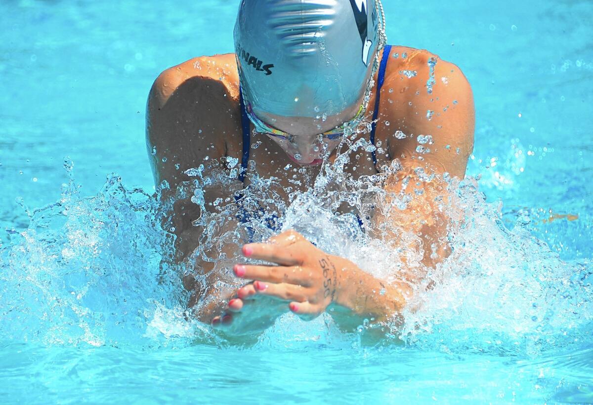 Lauren Openshaw of the Newport Hills Killer Whales broke a South Coast Swim Conference record in the girls’ 15-18 50-yard breaststroke, winning in 31.70 seconds.