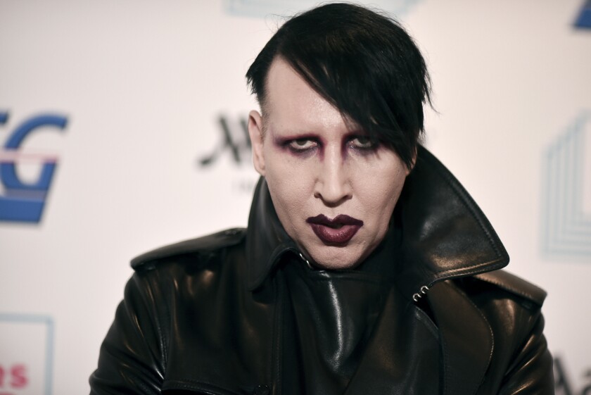 Marilyn Manson in a black leather jacket