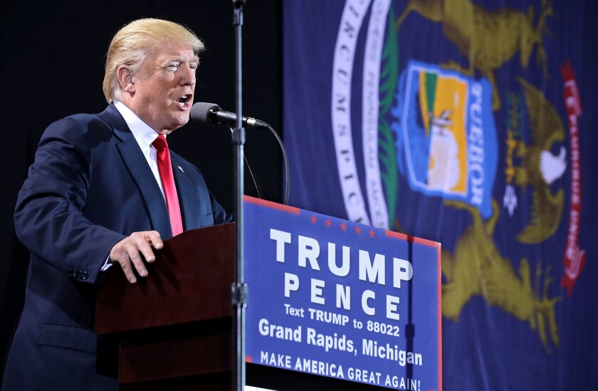 Donald Trump addresses a campaign rally Monday in Grand Rapids, Mich.