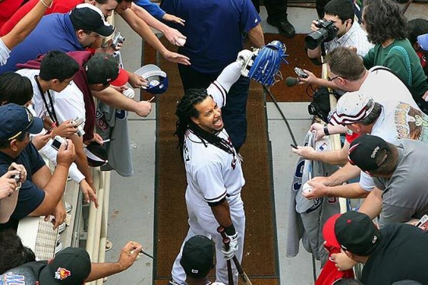 Manny Ramirez interacts with the Albuquerque fans before his first game since his suspension.