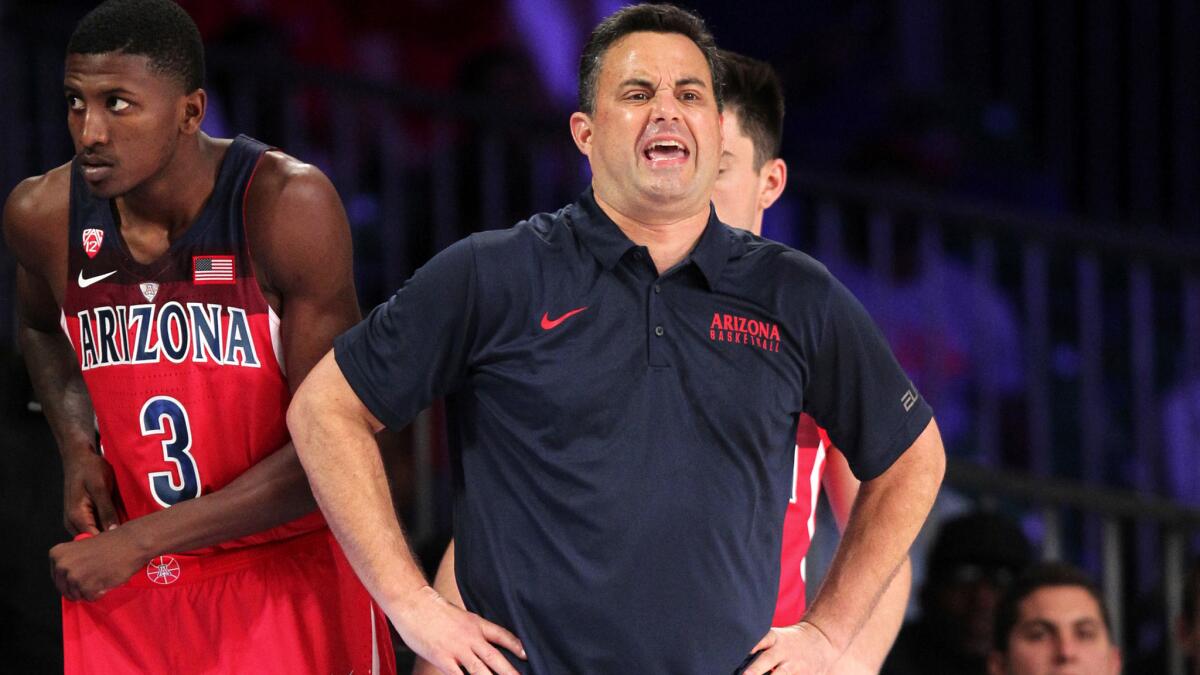 Arizona coach Sean Miller shouts instructions to his team during their loss to SMU on Thursday.