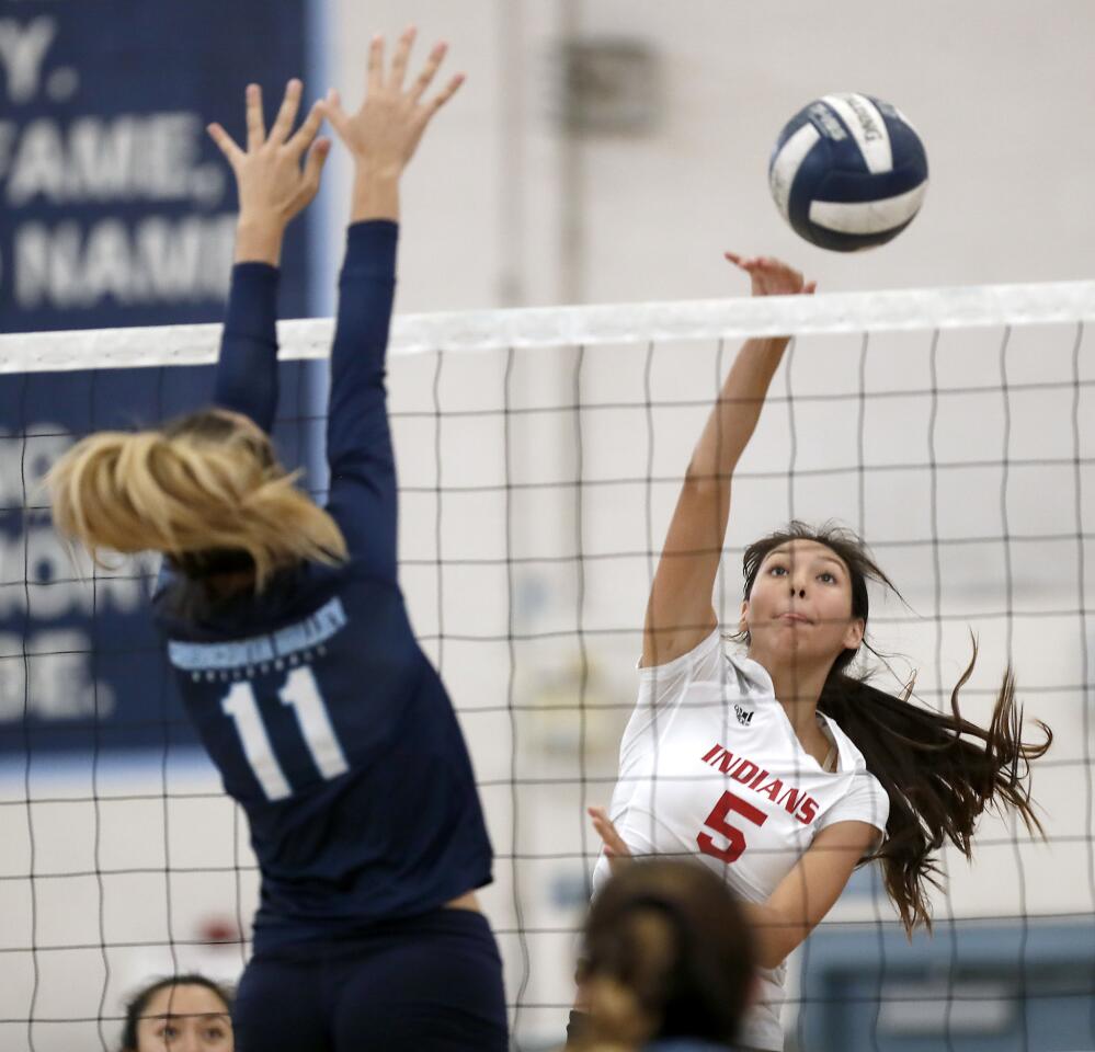 Burroughs' Camila Sanchez-Tellez hits the ball past Crescenta Valley's Grace Holland during a match on Wednesday, September 26, 2018.