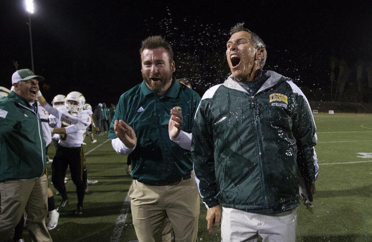Now-retired Edison head coach Dave White, celebrates after getting soaked following a 44-24 win in the CIF Southern Section Division 3 championship game on Dec. 2. Whit was honored as Cal-Hi Sports State Coach of the Year, and a search for his successor is continuing.