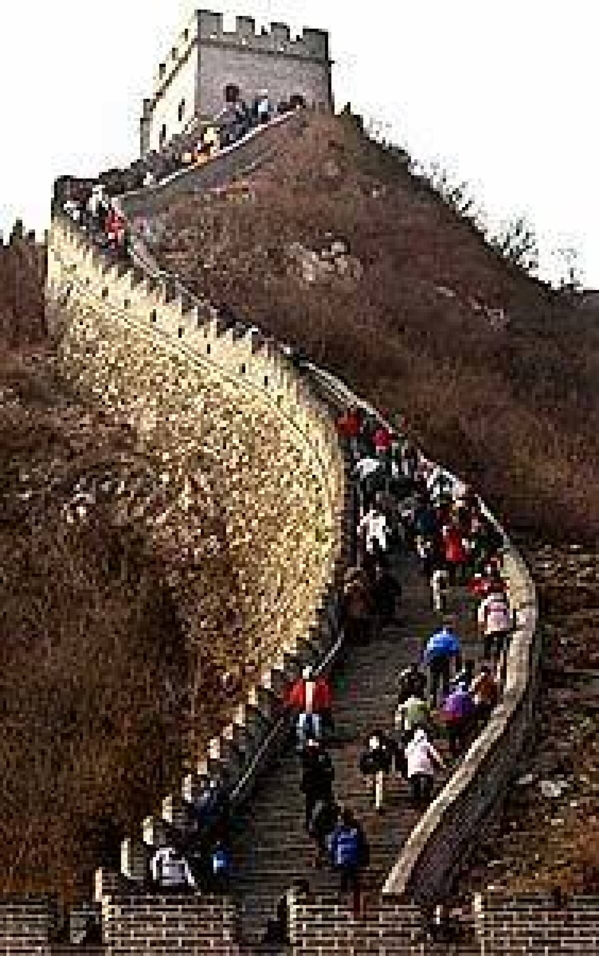 Tourists negotiate a steep section of the Great Wall outside Beijing. In varying states of repair, the landmark runs about 4,000 miles from east to west, across five Chinese provinces.