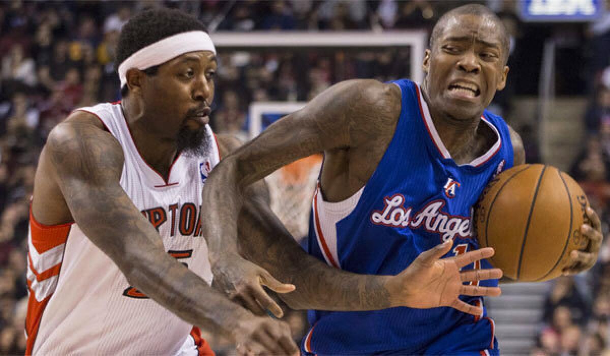 The Clippers' Jamal Crawford, right, drives past the Raptors' John Salmons on Saturday in Toronto.