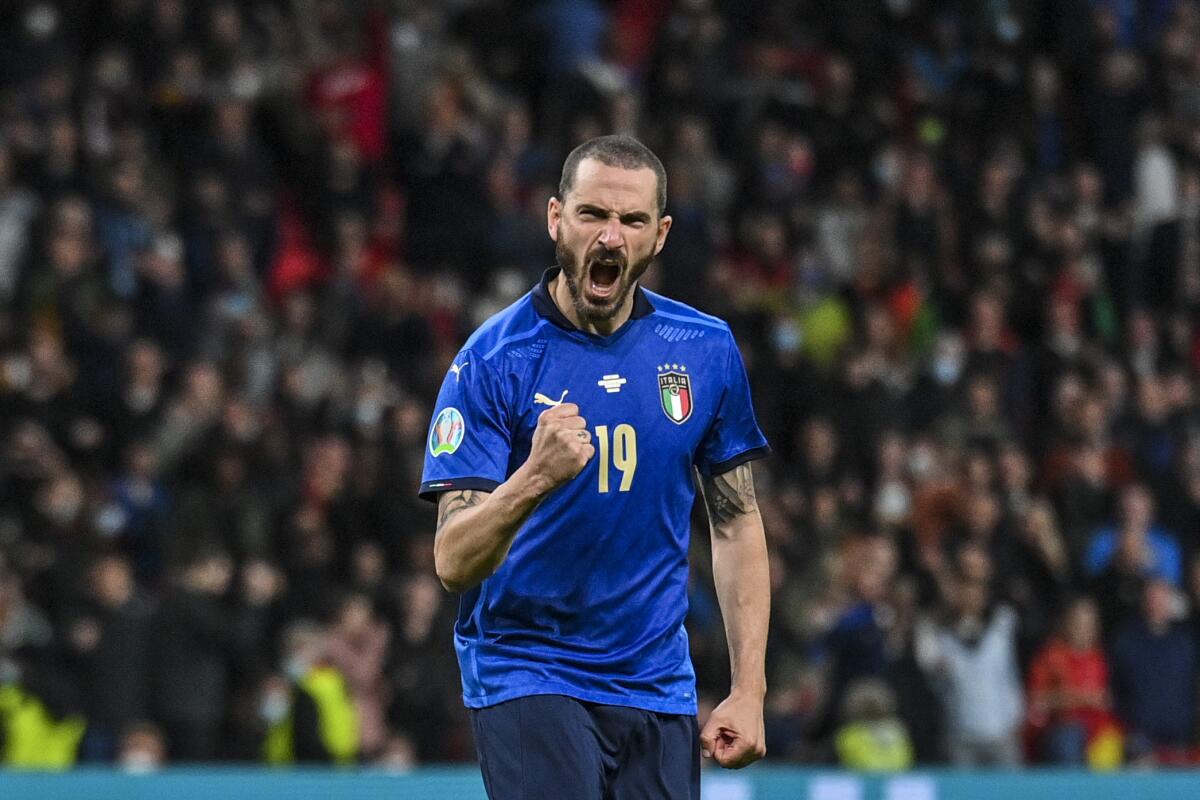 Italy's Leonardo Bonucci reacts after scoring a penalty kick during the Euro 2020 soccer championship semifinal match between Italy and Spain at Wembley stadium in London, England, Tuesday, July 6, 2021. (Justin Tallis/Pool Photo via AP)