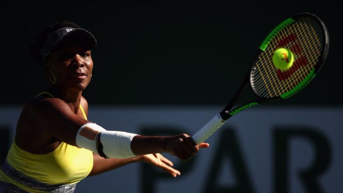 Venus Williams plays a backhand against Lucie Safarova in their third-round match during the BNP Paribas Open at Indian Wells Tennis Garden on March 13.