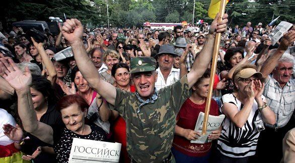 South Ossetian people celebrate Russia's recognition of the independence of South Ossetia and Abkhazia during a rally in Tskhinvali, the capital of South Ossetia. Russian President Dmitry Medvedev has signed a decree recognizing the independence of South Ossetia and Abkhazia.