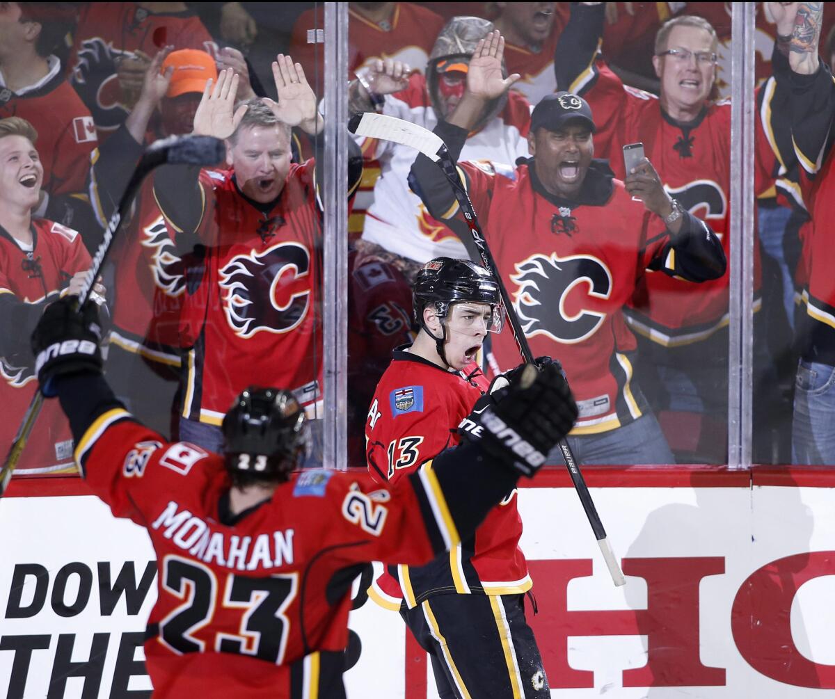 Calgary forward Johnny Gaudreau celebrates after scoring the game-tying goal in the third period to force overtime. The Flames beat the Ducks, 4-3, in overtime.