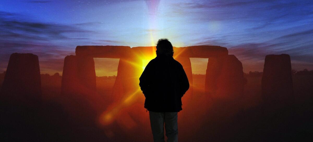 A visitor stands inside the new exhibition and visitor center at Stonehenge near Salisbury, Britain.