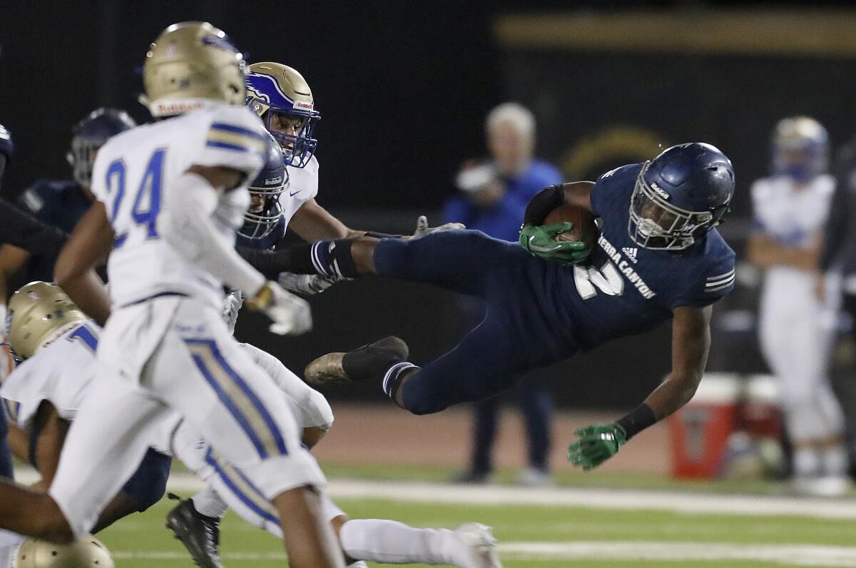Sierra Canyon's DJ Harvey gets airborne after a catch and run