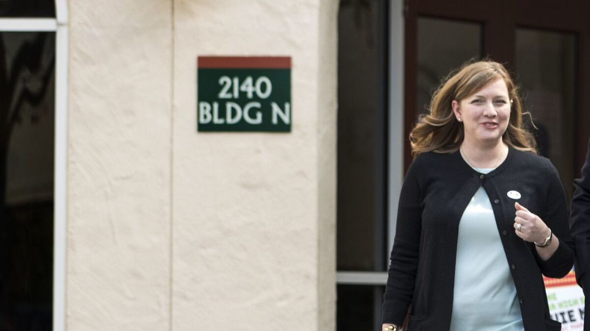 Congressional candidate Lizzie Fletcher leaves a primary polling place on March 6. The lawyer says Democrats must broaden their appeal beyond the base to win Houston's GOP-held seat.