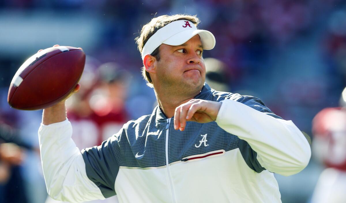 Alabama offensive coordinator Lane Kiffin throws a pass during warmups before a Nov. 26 game against Auburn.