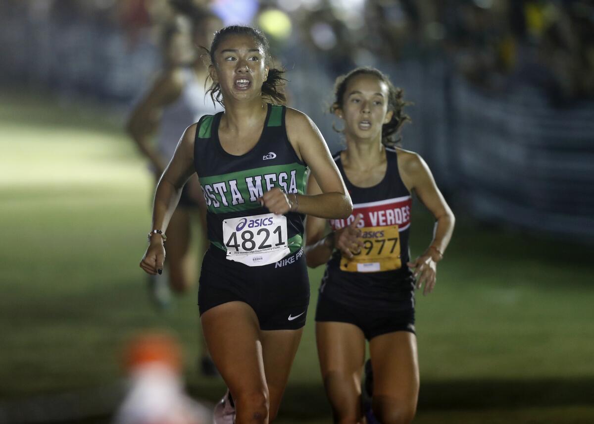 Costa Mesa senior Diane Molina competes in the Bob Day's girls' sweepstakes race in the 39th annual Woodbridge Invitational at SilverLakes Sports Park in Norco on Sept. 21.