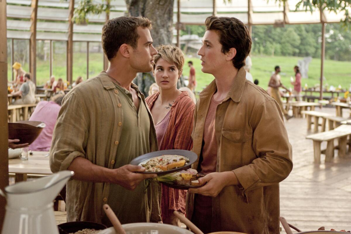 Theo James, Shailene Woodley and Miles Teller in a scene from "Insurgent."
