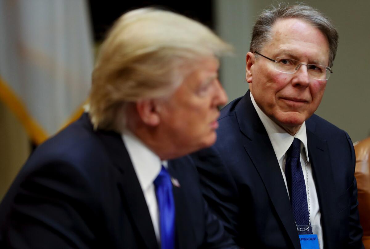 Feb. 2017 photo of National Rifle Associations (NRA) Chief Executive Officer Wayne LaPierre listening at as President Donald Trump speaks in the Roosevelt Room of the White House.