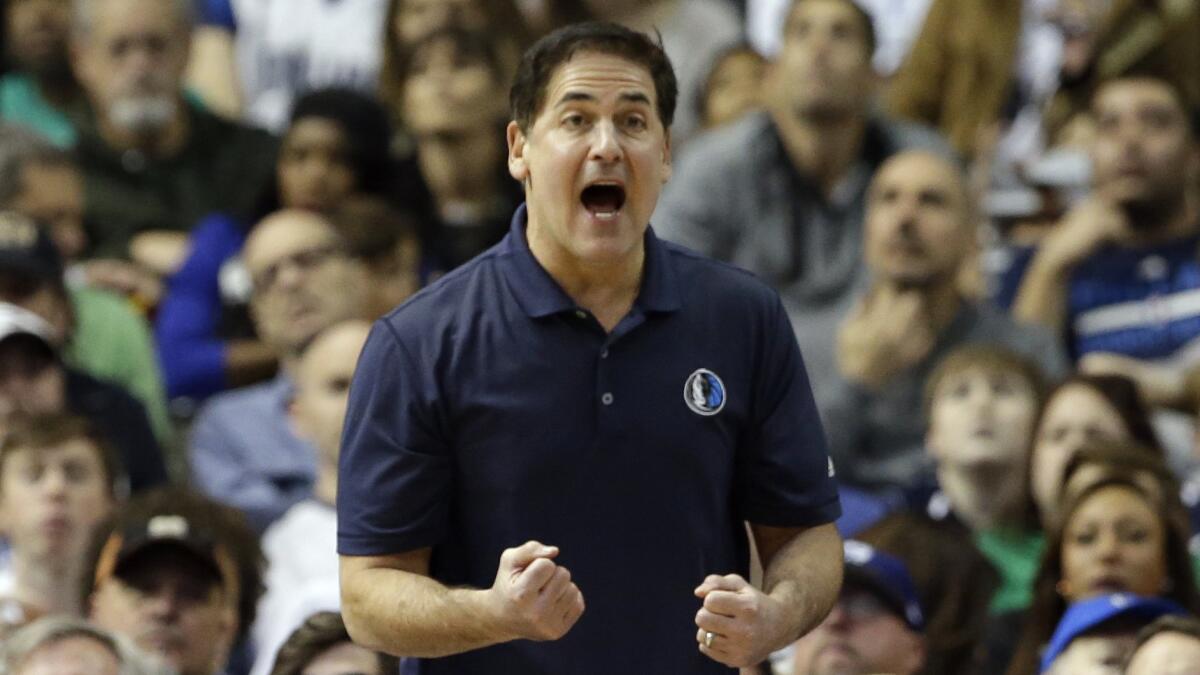 Dallas Mavericks owner Mark Cuban shouts during a game against the Golden State Warriors in Dallas on Dec. 13, 2014.