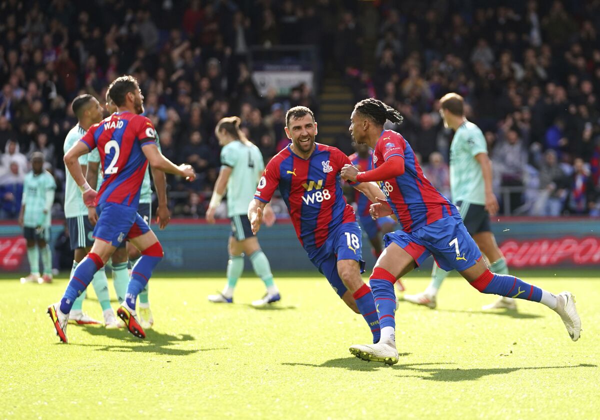 Crystal Palace's Michael Olise, right, celebrates scoring during the English Premier League soccer match between Crystal Palace and Leicester City at Selhurst Park, London, Sunday Oct. 3, 2021. (John Walton/PA via AP)