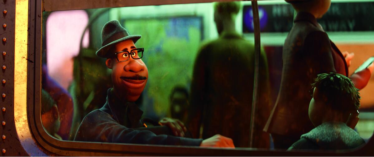 The lead character of "Soul" looks out a subway window, a half-smile on his face.