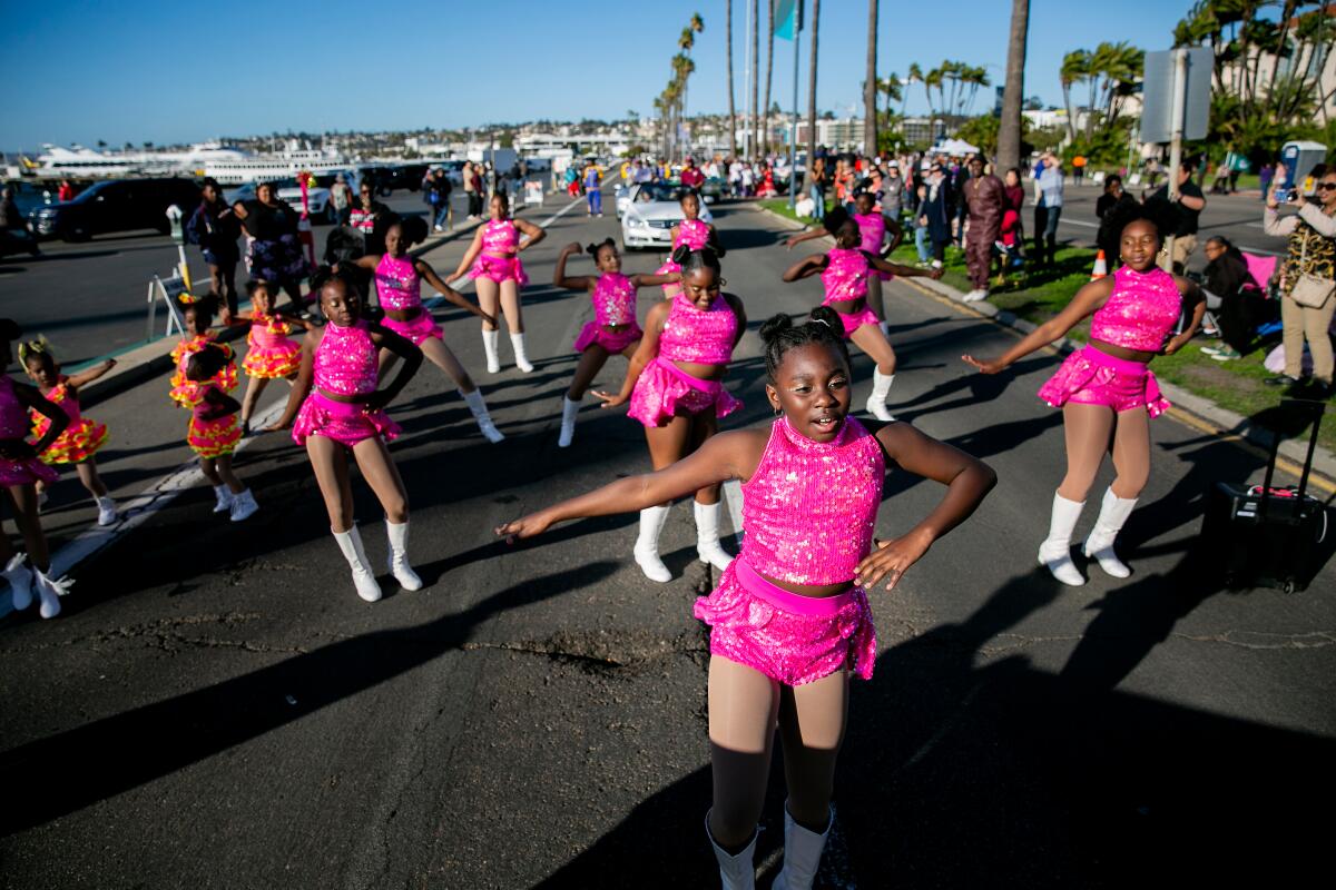 Members of "Diamond Dolls," a youth dance group, take part in the Martin Luther King Jr. Day Parade along North Harbor Drive in San Diego, California.