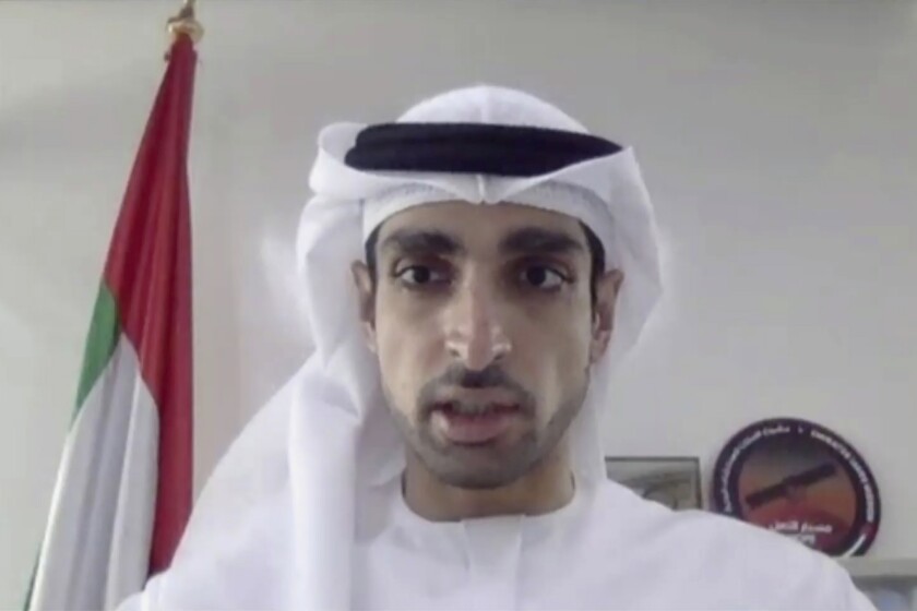 In this image made from video released by Mitsubishi Heavy Industries, project manager Omran Sharaf speaks during a pre-launch video briefing of a Mars orbiter, Monday, July 13, 2020. The United Arab Emirates is up first with the Martian orbiter set to launch from Japan on Wednesday, July 15. The liftoff of the Mars orbiter named Amal, or Hope, from Japan marked the start of a rush to fly to Earth's neighbor. (Mitsubishi Heavy Industries via AP)