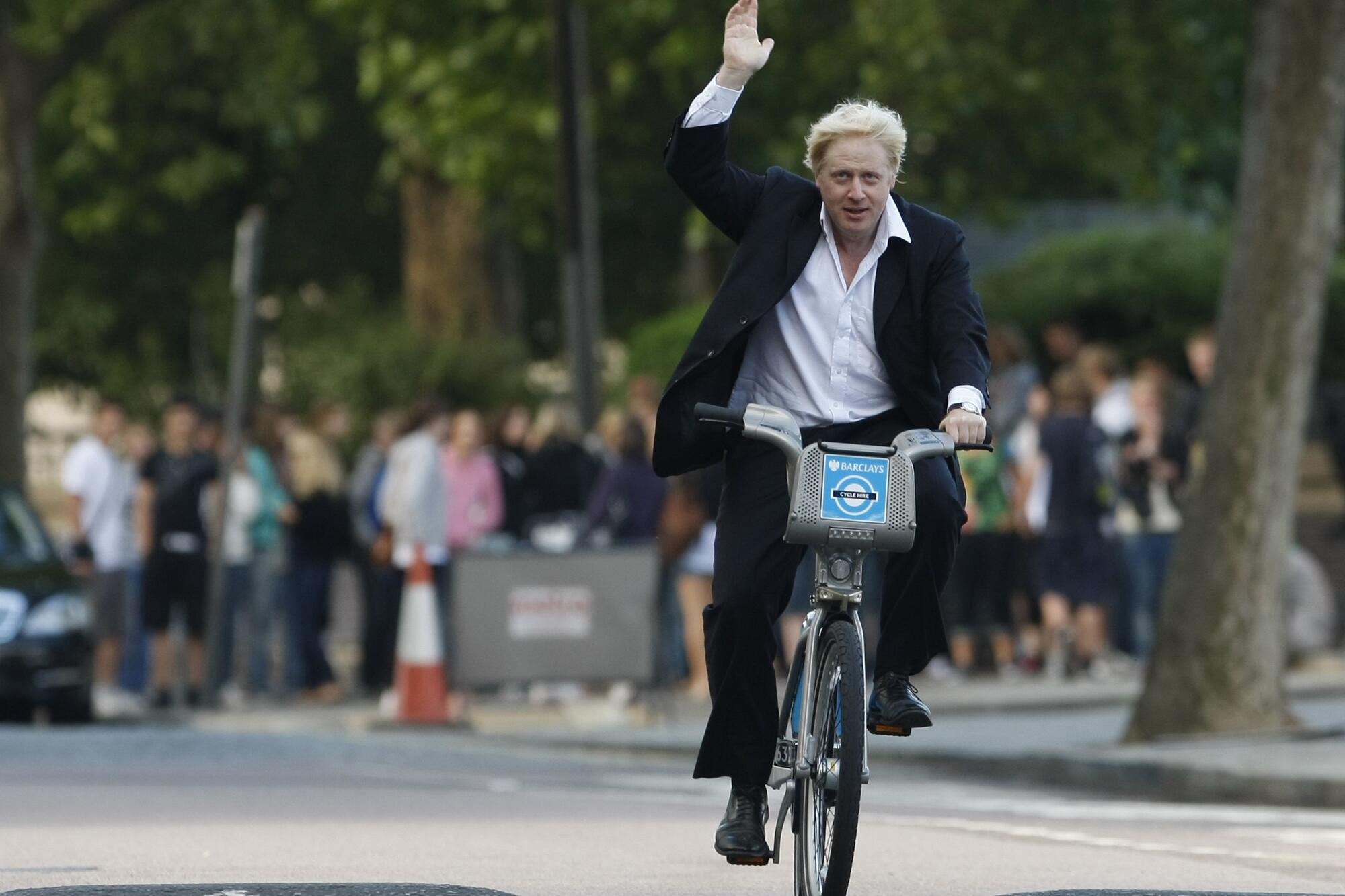 Boris Johnson, Mayor of London waves to the media as he helps launch a new cycle hire scheme in London.