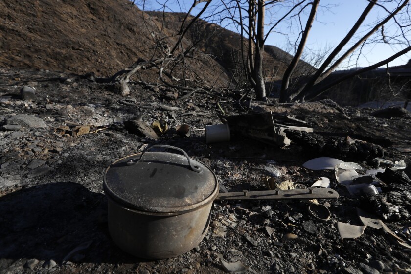 A scorched pot is among the few remnants of a homeless encampment burned in the Skirball fire in 2017.