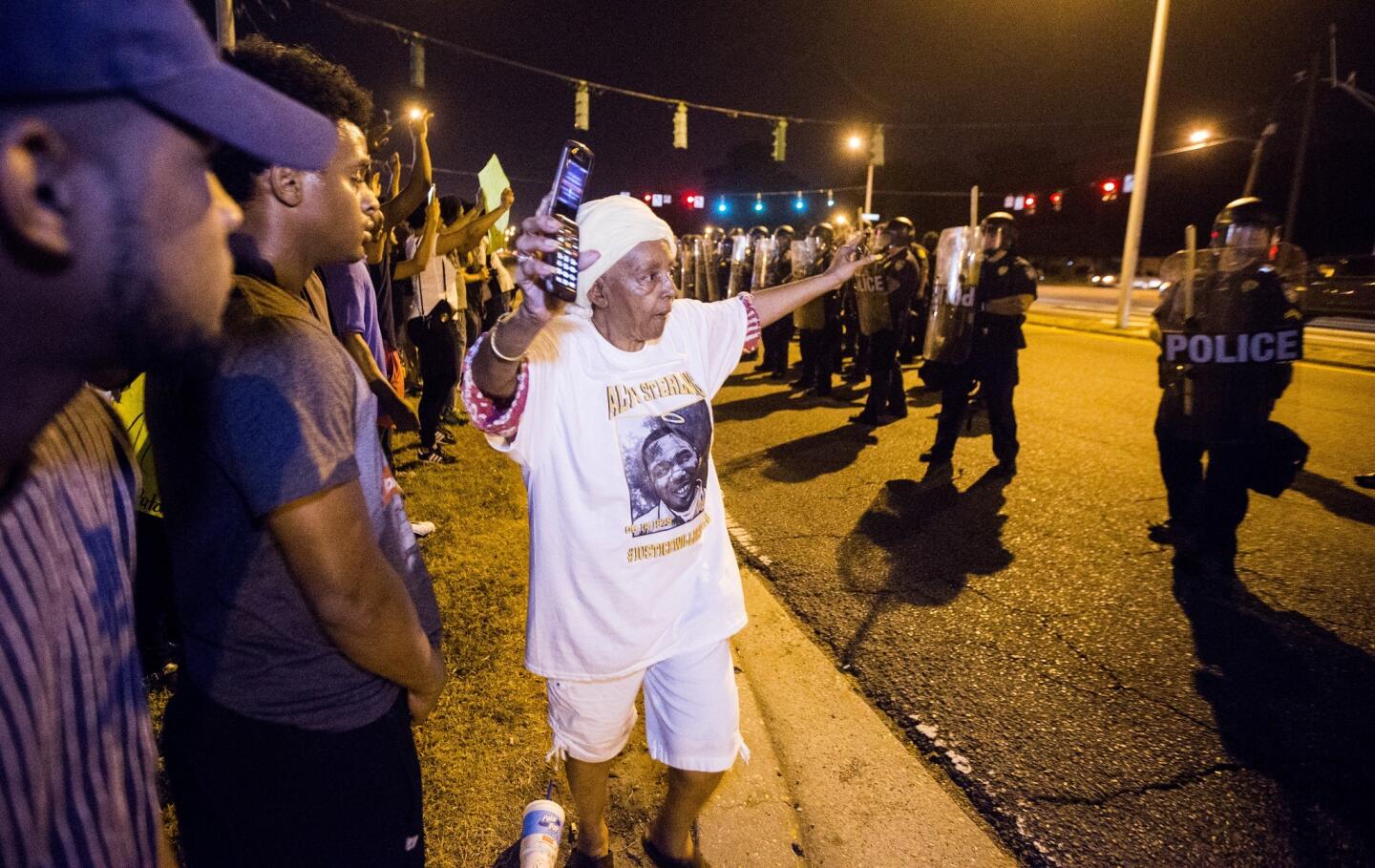 People gather to protest the shooting of Alton Sterling on July 10, 2016, in Baton Rouge, Louisiana.