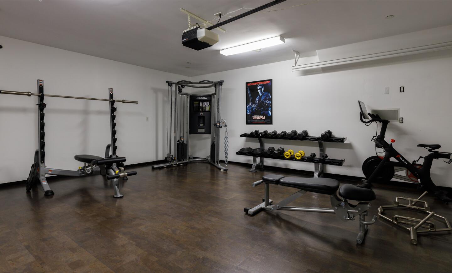 Workout equipment fills a room.