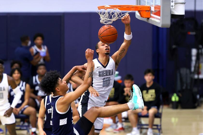 Sierra Canyon's Amariz Bailey goes up for a dunk against St. John Bosco on May 28, 2021, in the playoffs.