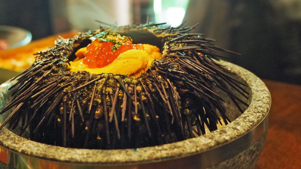 Uni with a custard egg, rice and seafood is served at Hanjip in Culver City.