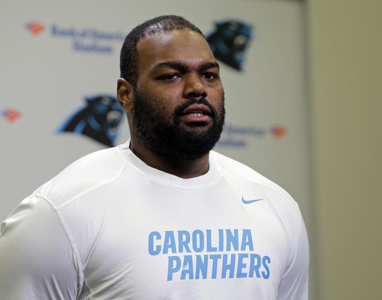 Michael Oher speaks to the media during the first day of Carolina Panthers' offseason conditioning program.