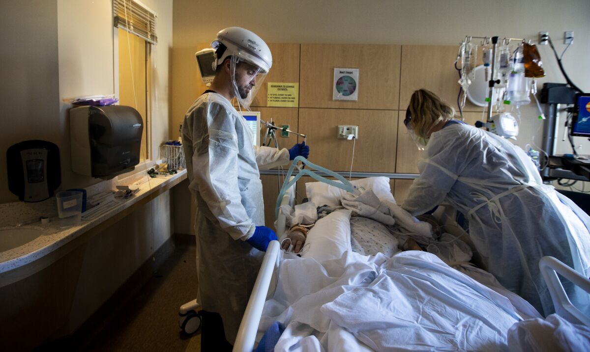 Nurses reposition a COVID positive patient  at Providence Holy Cross Medical Center  Mission Hills. 