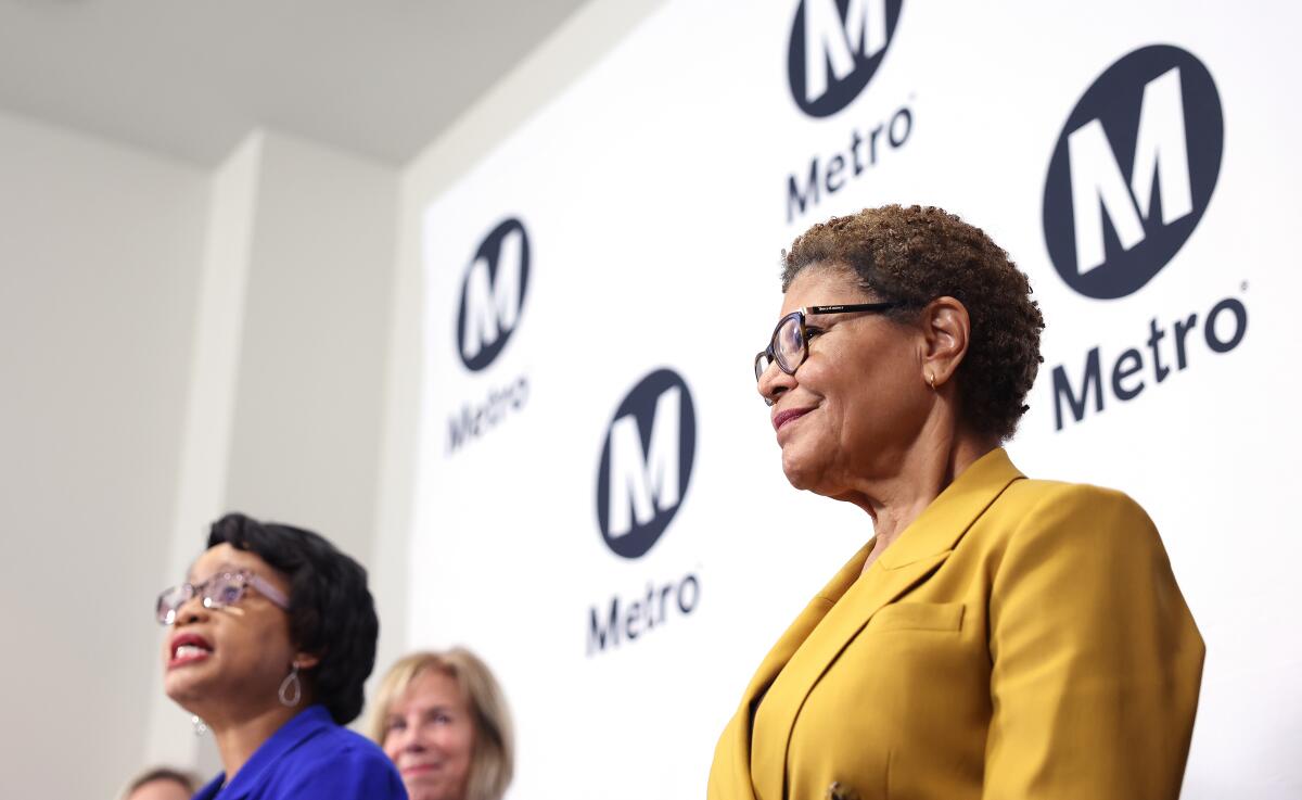 Los Angeles Mayor Karen Bass, right, stands with Metro leaders including Metro CEO Stephanie Wiggins, left.