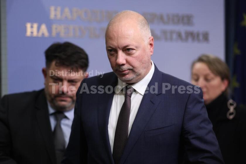 Bulgarian Prime Minister Rosen Zhelyazkov announces that Bulgaria's government resigns following mass protests, at the Bulgarian Parliament in Sofia, Bulgaria, Thursday, Dec. 11, 2025. (Bulgarian News Agency via AP)