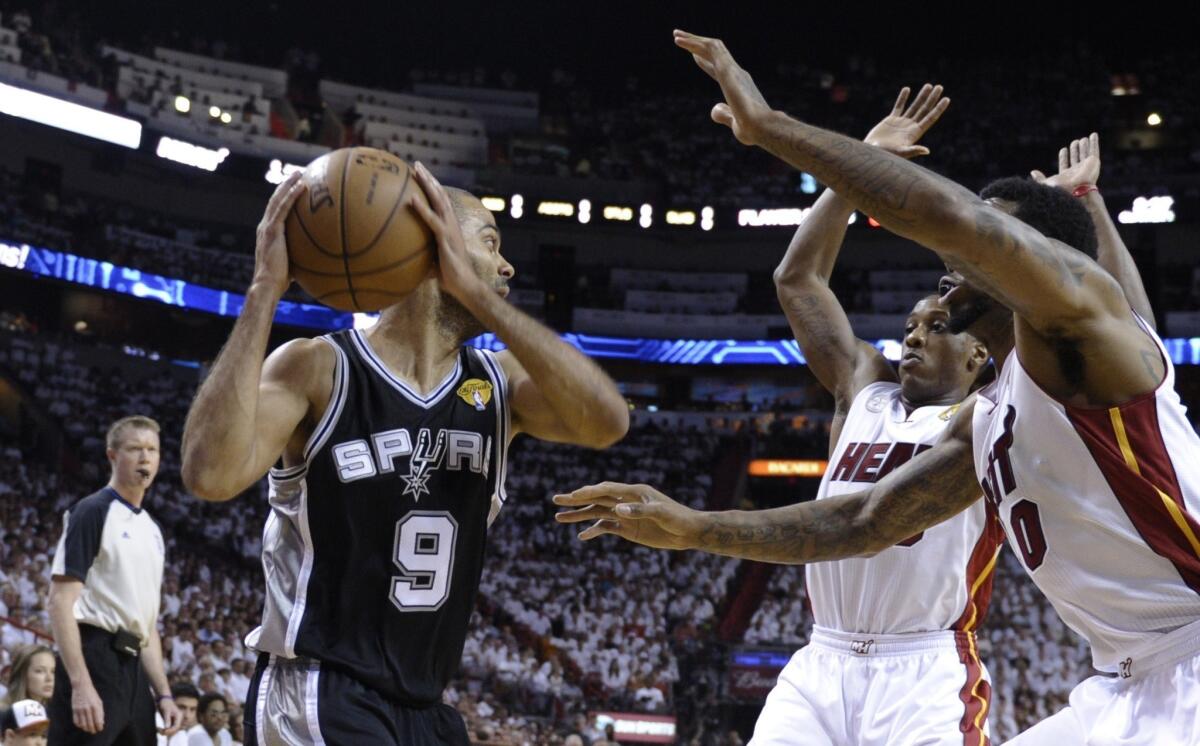 San Antonio's Tony Parker, double-teamed by Miami's Mario Chalmers and Udonis Haslem, went from no turnovers in Game 1 of the NBA Finals to five in Game 2.