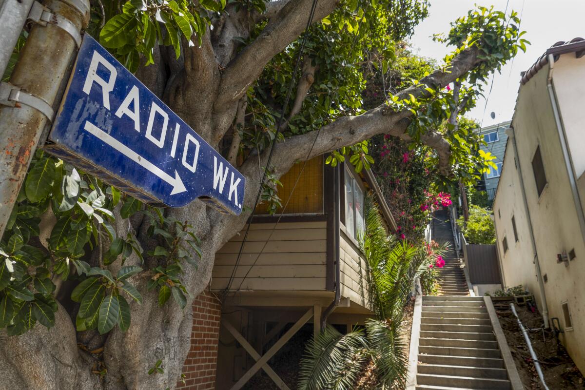 A sign reading "Radio Walk" points up a set of concrete stairs.