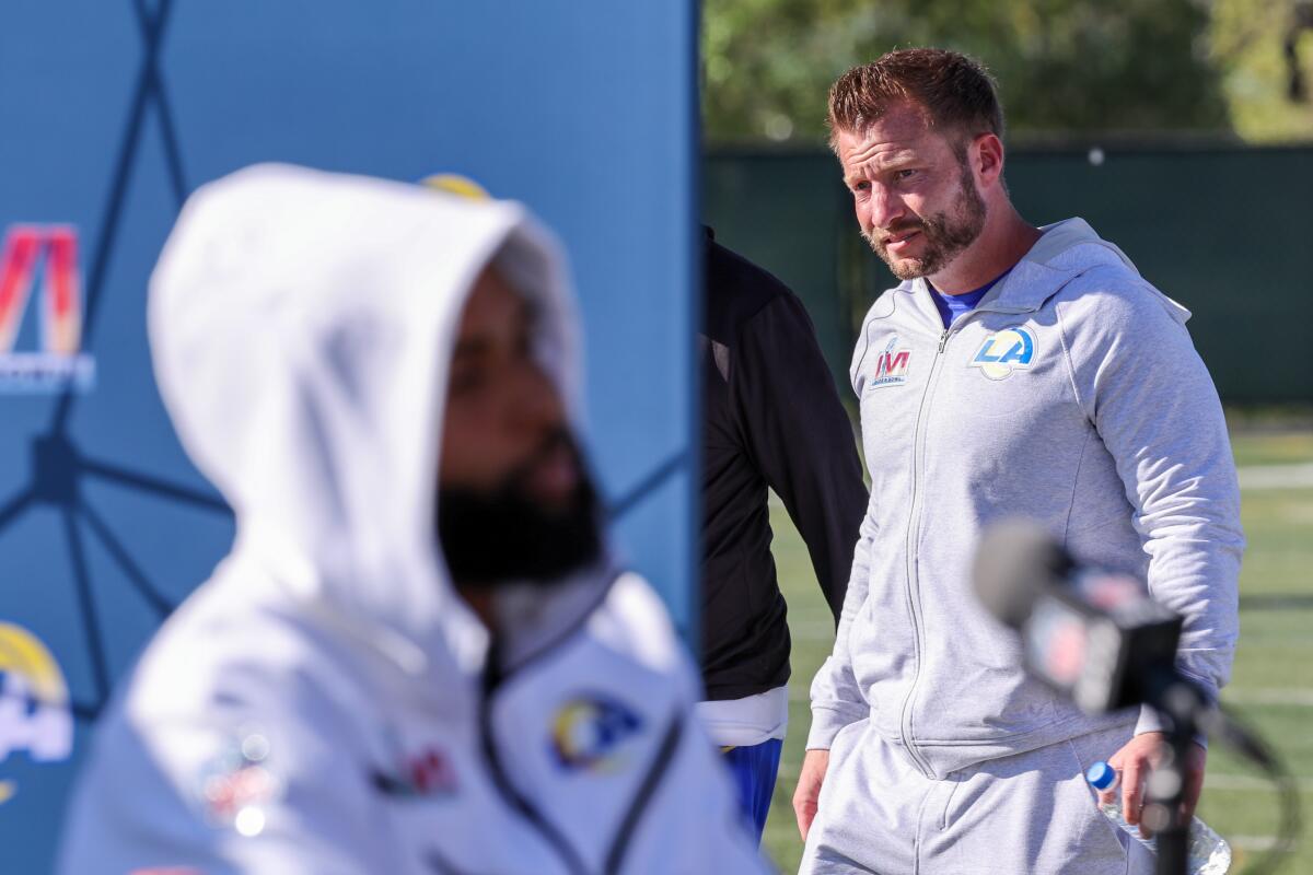 Rams coach Sean McVay (right) walks past receiver Odell Beckham Jr. during Super Bowl media conferences.