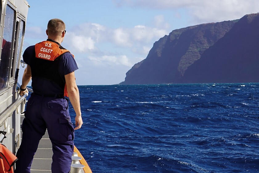 A U.S. Coast Guard boat moves toward the site of a tour helicopter crash near the Hawaiian island of Kauai on Dec. 27.