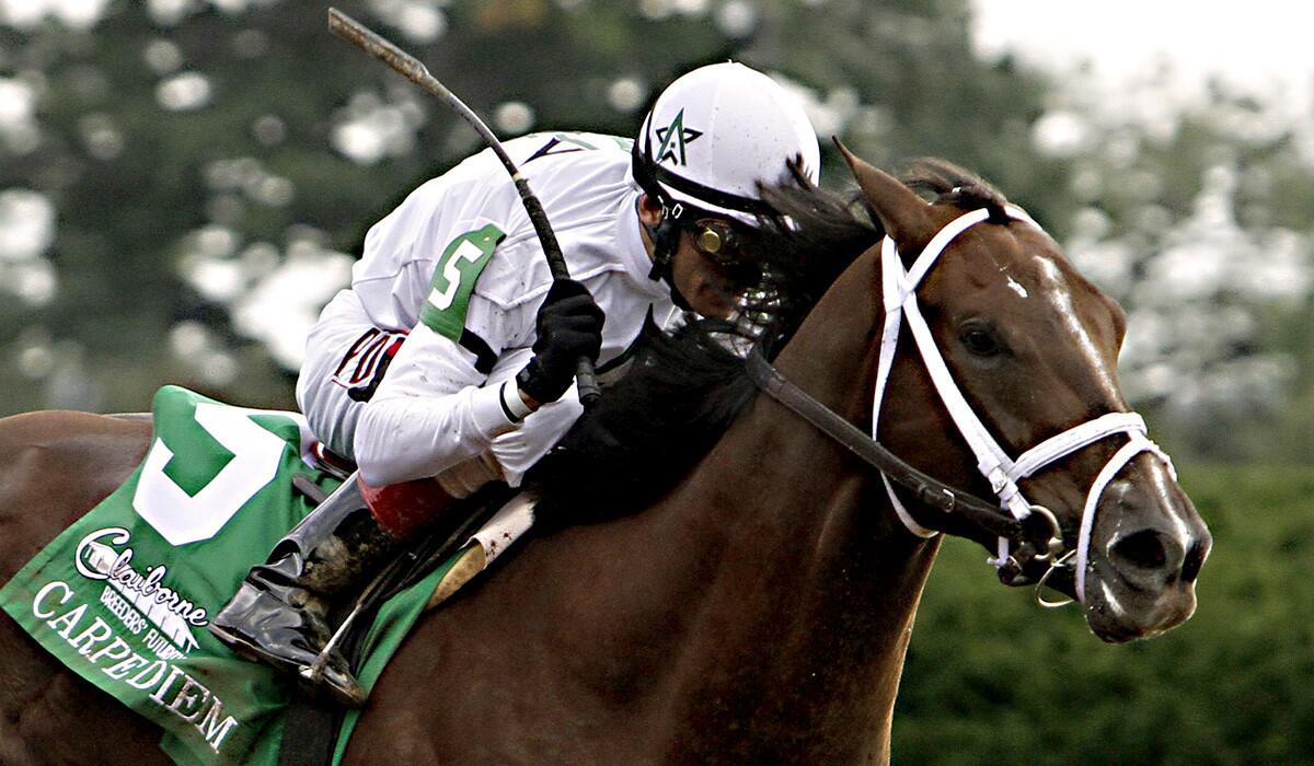 Jockey John Velazquez rides Carpe Diem to a six-length victory in the Breeders' Futurity Stakes at Keeneland Race Course earlier this month.