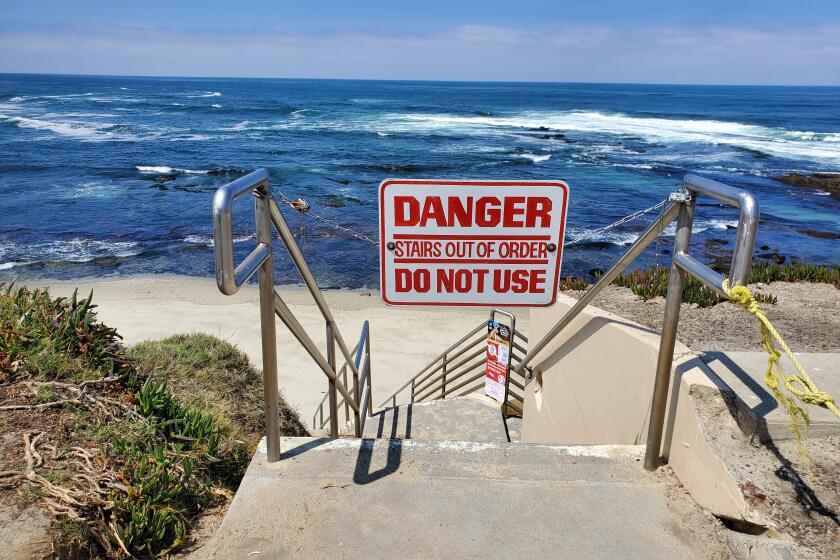 The stairway at South Casa Beach is closed by way of a sign and chain.