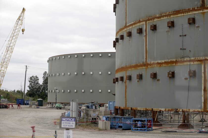 FILE - In this Sept. 21, 2016 file photo, parts of a containment building for the V.C. Summer Nuclear Station is shown near Jenkinsville, S.C., during a media tour of the facility. A former official for the contractor hired to build two nuclear reactors at the V.C. Summer plant that were never completed, pleaded guilty Thursday, June 10, 2021, to lying to federal authorities.(AP Photo/Chuck Burton, File)