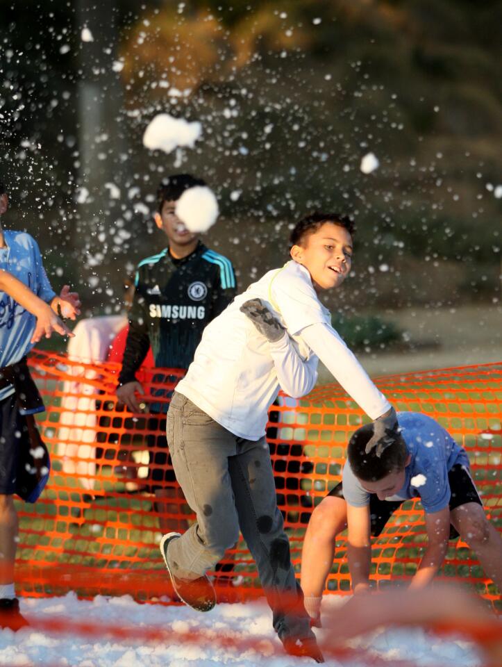Will Boyd, 9 of La Cañada Flintridge, got a chance to throw some snowball fight with friends during the 21st Festival in Lights at Memorial Park in La Cañada Flintridge on Friday, Dec. 4, 2015.