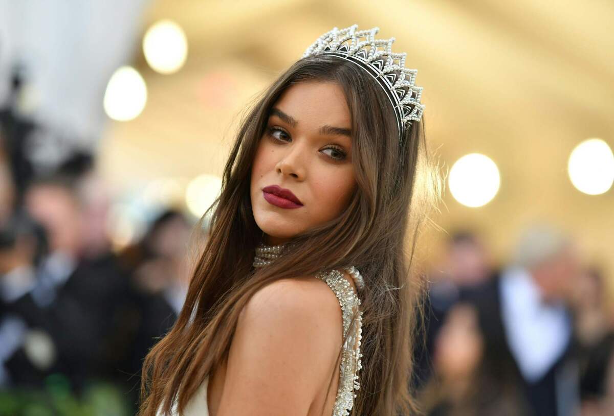 Hailee Steinfeld's crimson pout works as a statement accessory.