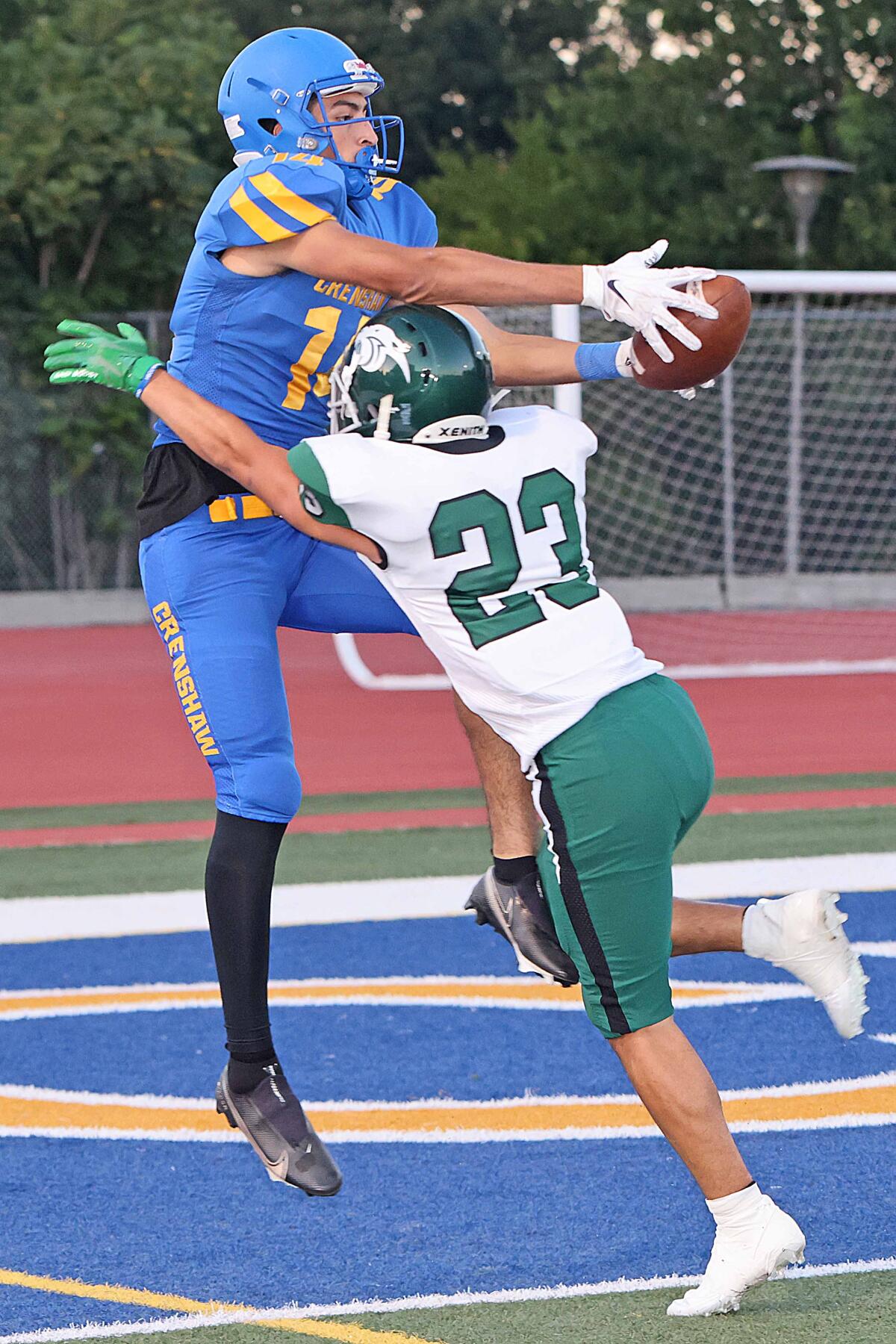 Roberto Salazar is a three-sport athlete for Crenshaw trying to make catch in football game.